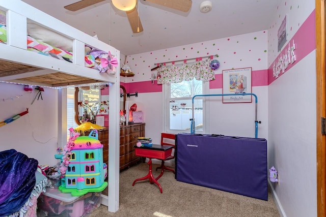 playroom featuring a ceiling fan and carpet