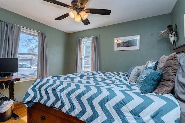 bedroom featuring ceiling fan and wood finished floors