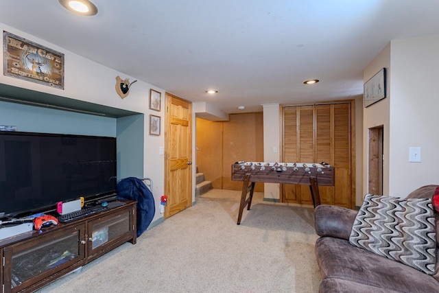 recreation room with recessed lighting and light colored carpet