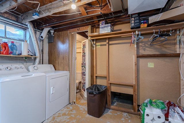 washroom with washing machine and clothes dryer and laundry area