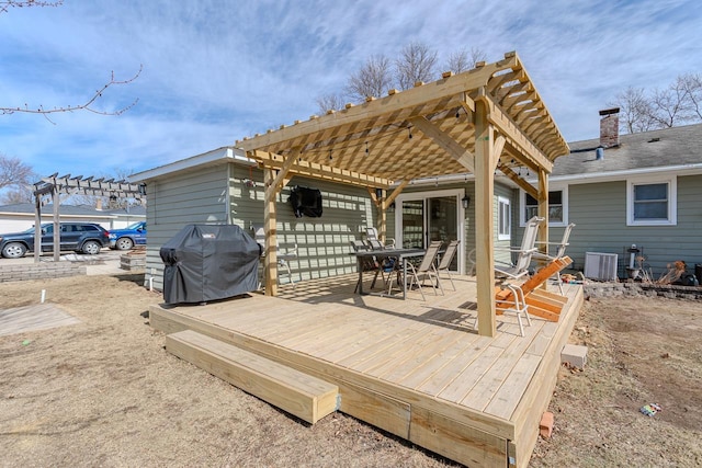 wooden terrace featuring area for grilling, central AC unit, a pergola, and outdoor dining area