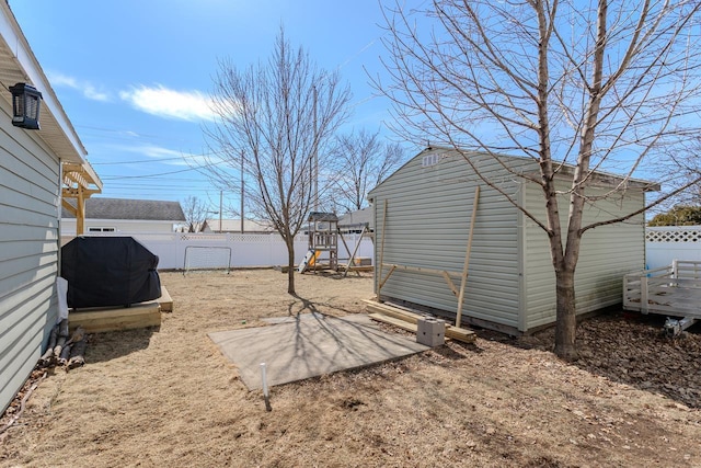 view of yard with an outbuilding and a fenced backyard