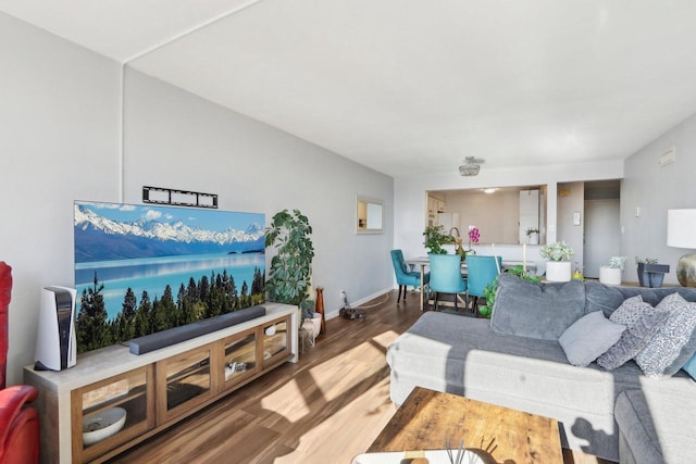 living room with baseboards and wood finished floors