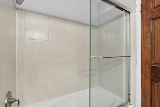 full bathroom featuring combined bath / shower with glass door