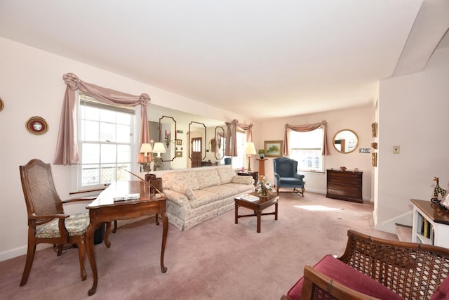 living room with light colored carpet and baseboards