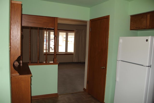 kitchen featuring freestanding refrigerator