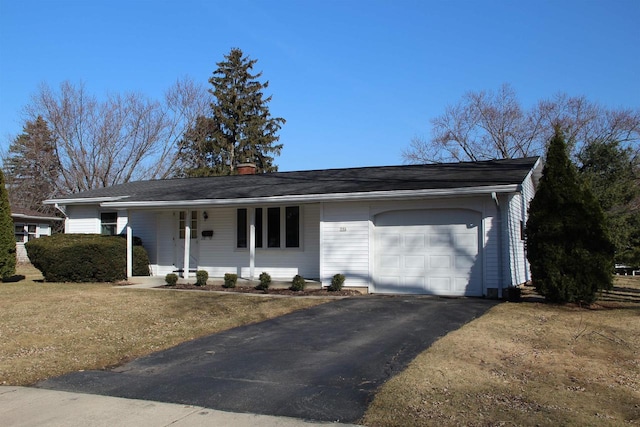 ranch-style house with driveway, a chimney, and an attached garage