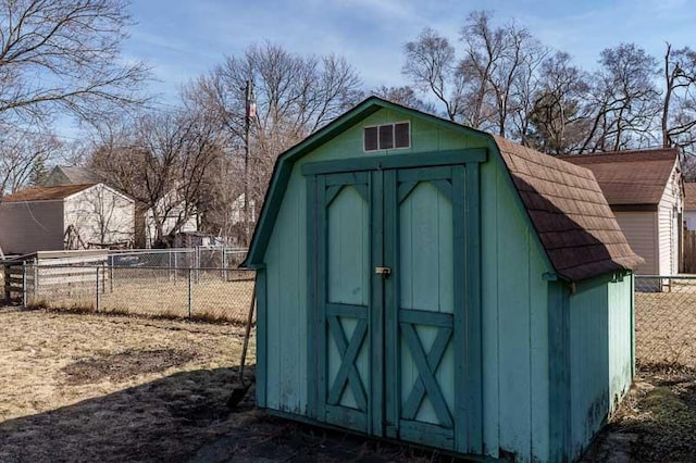 view of shed with fence