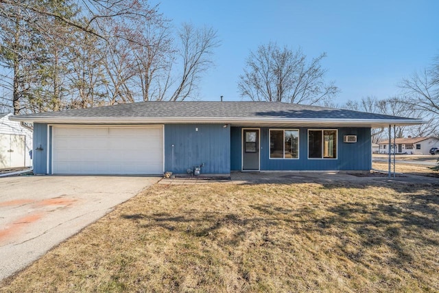 ranch-style home featuring a garage, a front yard, and driveway