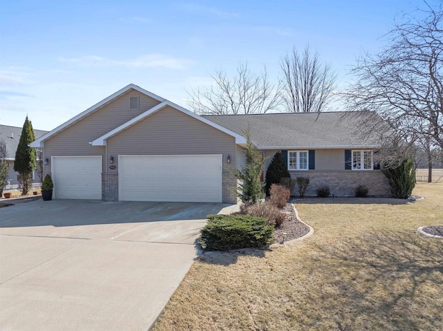 ranch-style house with brick siding, driveway, an attached garage, and a front yard