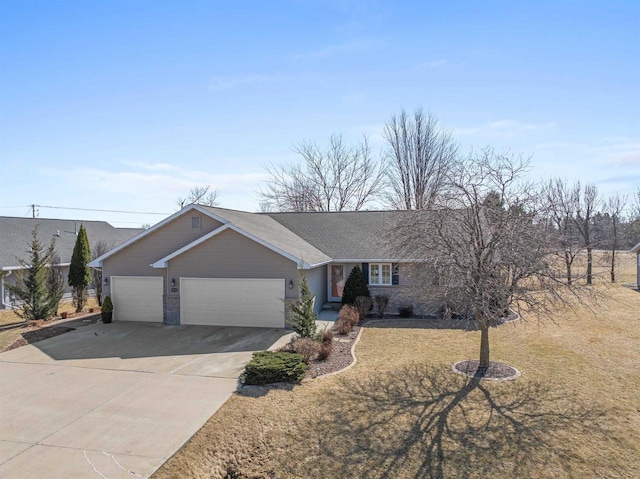 ranch-style house with a garage, brick siding, and driveway