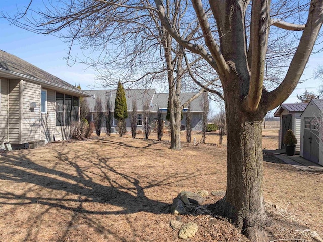 view of yard with a shed and an outdoor structure