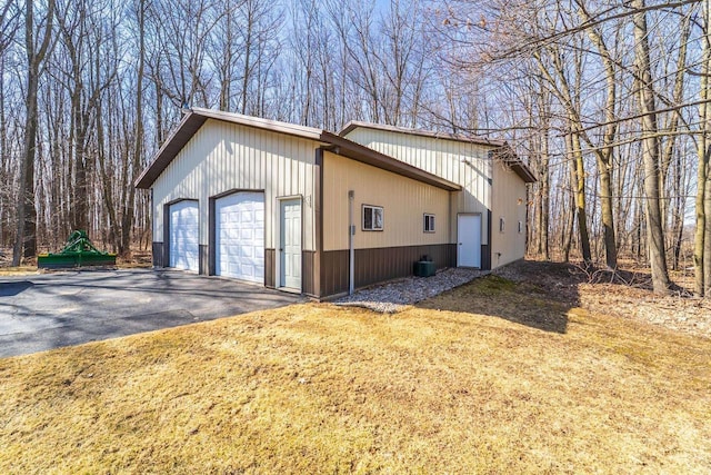 view of side of property with a garage