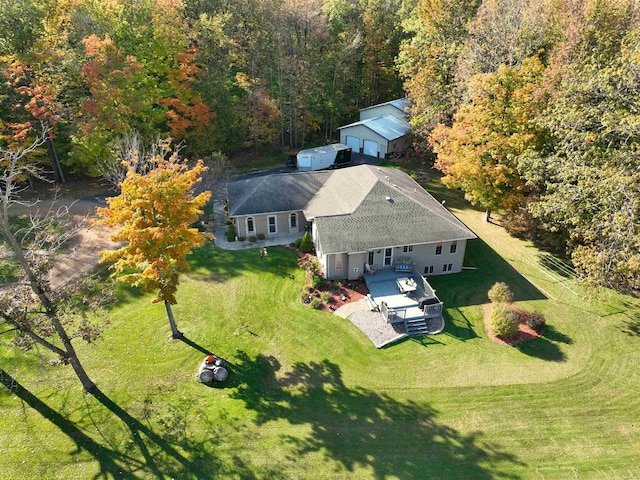 aerial view featuring a wooded view