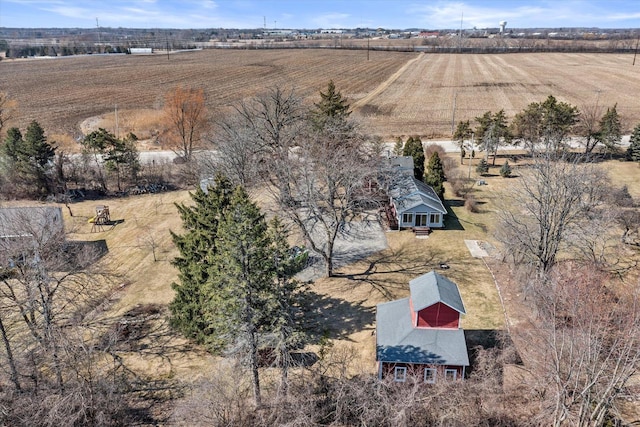 birds eye view of property with a rural view