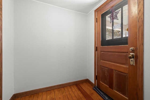 entryway featuring wood finished floors and baseboards