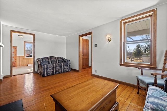 living room with wainscoting and hardwood / wood-style flooring