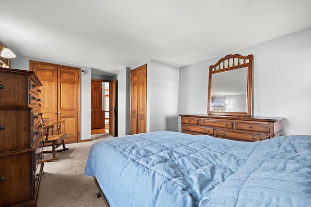 bedroom featuring light carpet