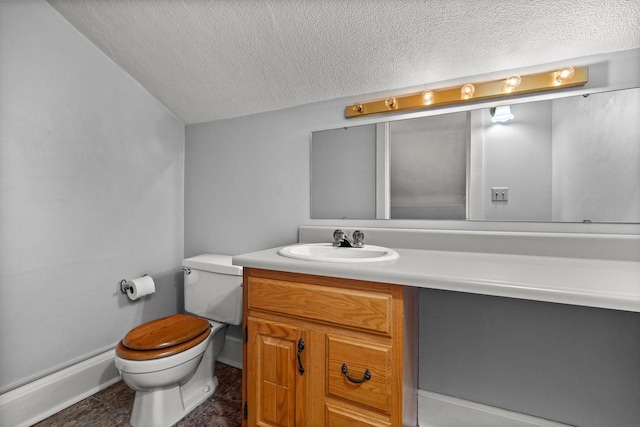 half bathroom with a baseboard heating unit, toilet, vanity, and a textured ceiling