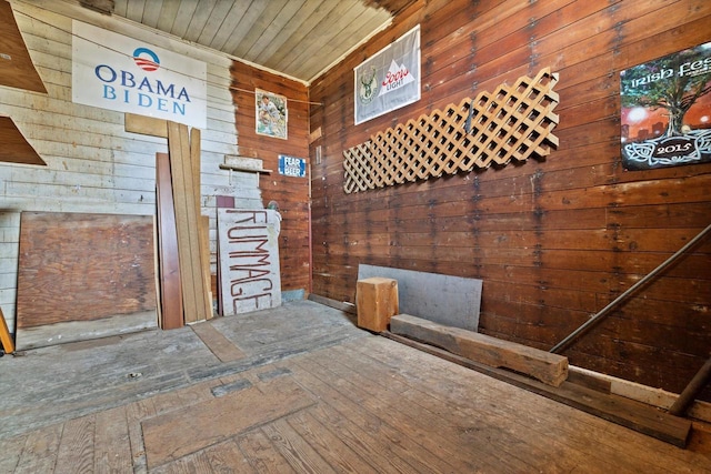 interior space with wood walls and wooden ceiling