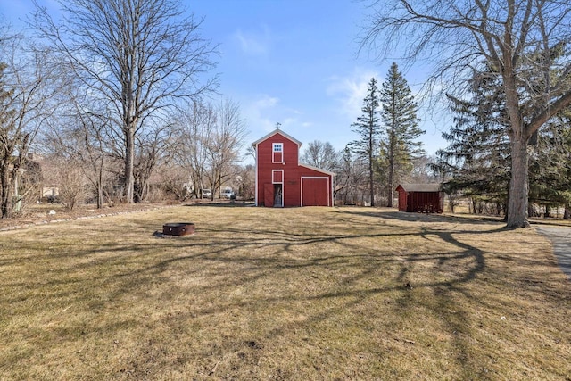 view of yard with a barn and an outdoor structure