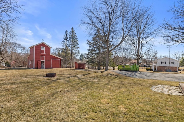 view of yard featuring a barn and an outdoor structure