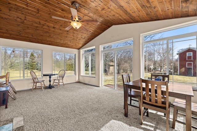 sunroom / solarium featuring wood ceiling, a ceiling fan, and vaulted ceiling