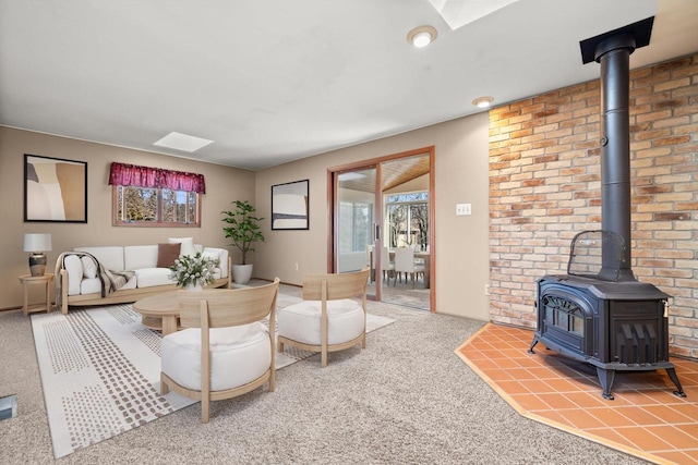 carpeted living area featuring a wood stove