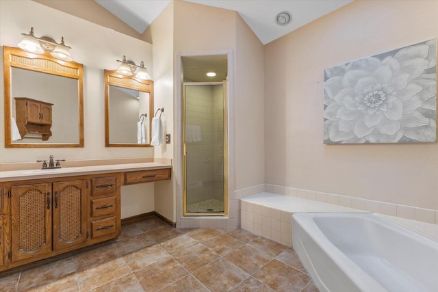 full bathroom with a shower stall, a garden tub, vanity, and lofted ceiling