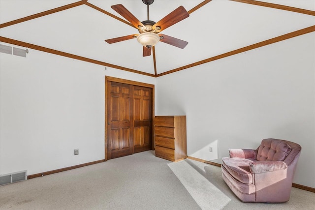 unfurnished room with visible vents, ceiling fan, baseboards, and carpet