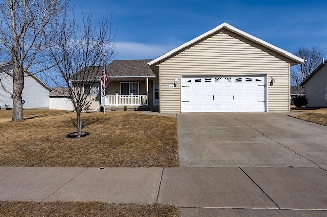 single story home with a garage, a front lawn, a porch, and driveway