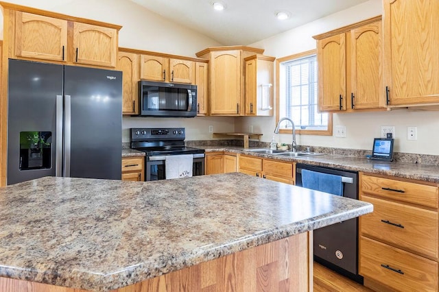 kitchen with a sink, a center island, recessed lighting, stainless steel appliances, and lofted ceiling