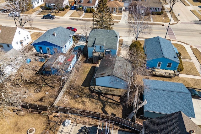 birds eye view of property with a residential view