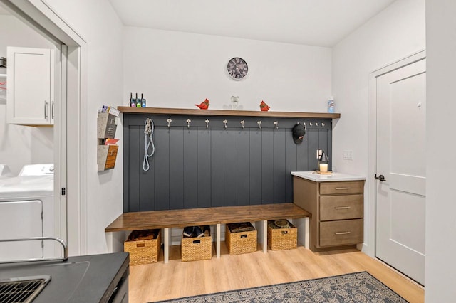 655 Sunset Grn, Bay, WI 54313 - mudroom featuring washer / dryer and light wood-style flooring