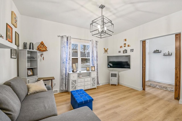 655 Sunset Grn, Bay, WI 54313 - living room with baseboards, a chandelier, and light wood finished floors