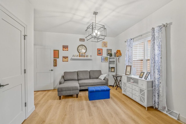 655 Sunset Grn, Bay, WI 54313 - living area featuring wood finished floors and a chandelier