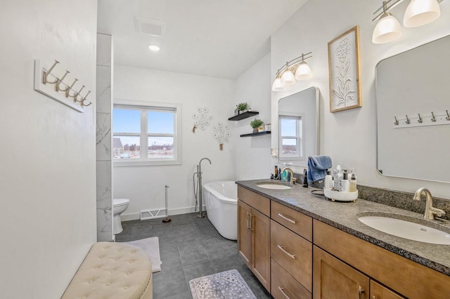 655 Sunset Grn, Bay, WI 54313 - full bath with a sink, baseboards, a freestanding bath, and tile patterned floors