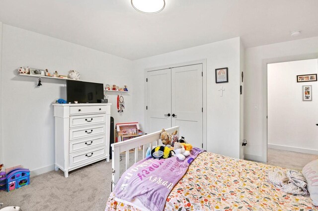 655 Sunset Grn, Bay, WI 54313 - bedroom with a closet, light carpet, and baseboards