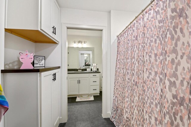 655 Sunset Grn, Bay, WI 54313 - full bathroom featuring tile patterned floors, vanity, and a shower with shower curtain