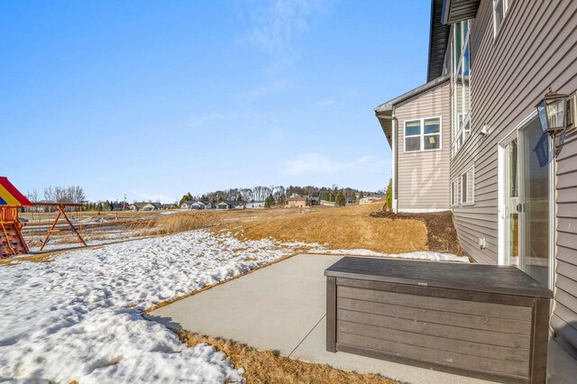655 Sunset Grn, Bay, WI 54313 - yard layered in snow with a patio area