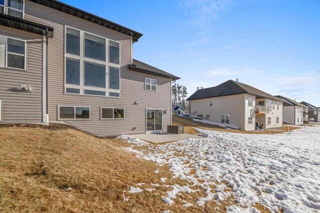 655 Sunset Grn, Bay, WI 54313 - snow covered house with a patio area and a residential view