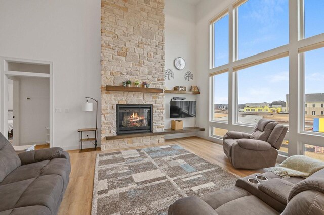 655 Sunset Grn, Bay, WI 54313 - living room with a wealth of natural light, a fireplace, and wood finished floors