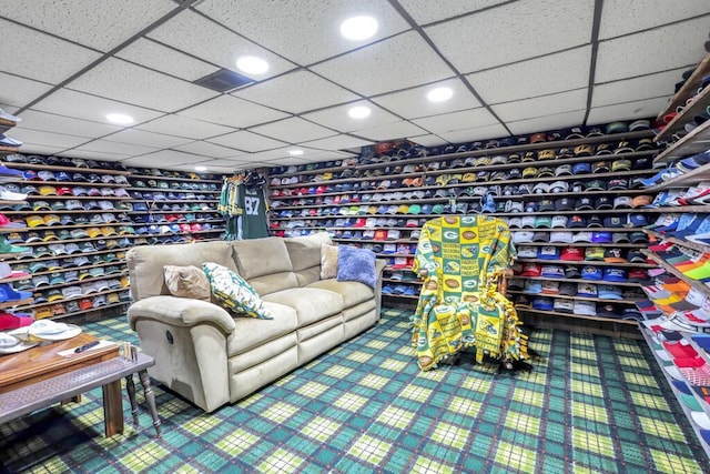 recreation room featuring a drop ceiling and recessed lighting