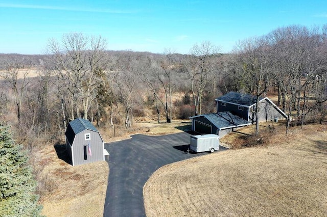 drone / aerial view with a view of trees