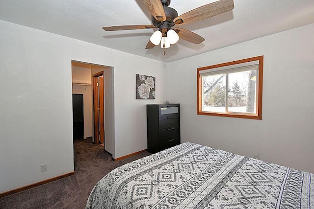 carpeted bedroom featuring ceiling fan and baseboards