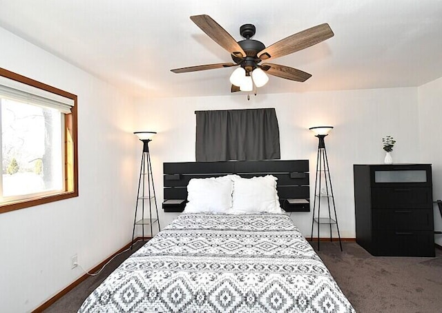 bedroom featuring baseboards, a ceiling fan, and dark carpet