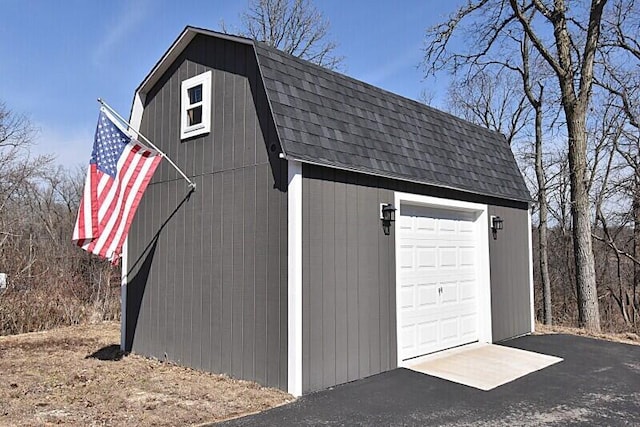 detached garage with aphalt driveway