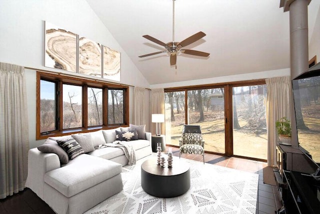 living area with lofted ceiling, a healthy amount of sunlight, and ceiling fan