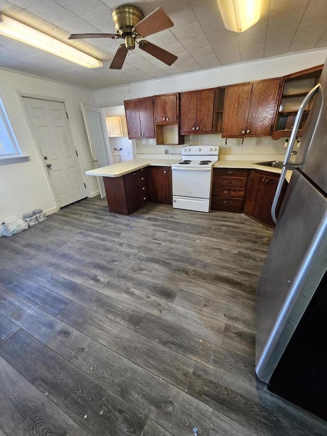 kitchen featuring open shelves, white range with electric cooktop, light countertops, a peninsula, and dark wood-style flooring