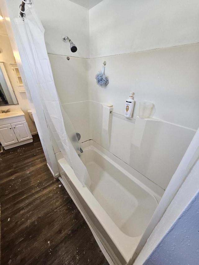 bathroom featuring vanity, shower / tub combo, and wood finished floors